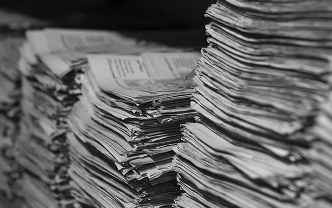 Old stacks of newspapers containing history of the library