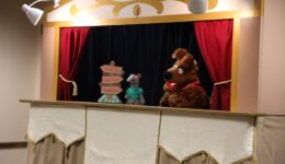 Dog and rat puppets on puppet stage