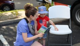 Woman reading to young child