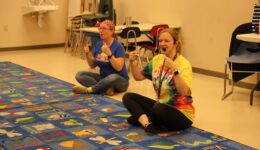 Guest and Librarian leading children's musical activities