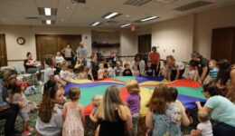Children and caregivers participating in Romp & Stomp