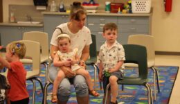 Children and caregivers listening to ASL storytime