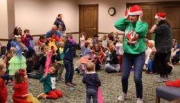 Caregivers and children enjoy our Santa Romp & Stomp with the Youth Librarians