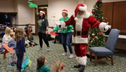 Caregivers and children enjoy our Santa Romp & Stomp with the Youth Librarians
