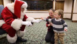 Santa visits with children and their caregivers