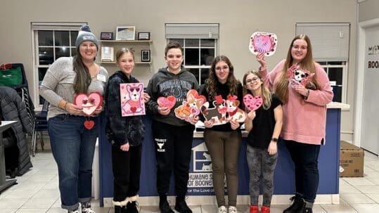 Teens showing their work at Boone County Humane Society