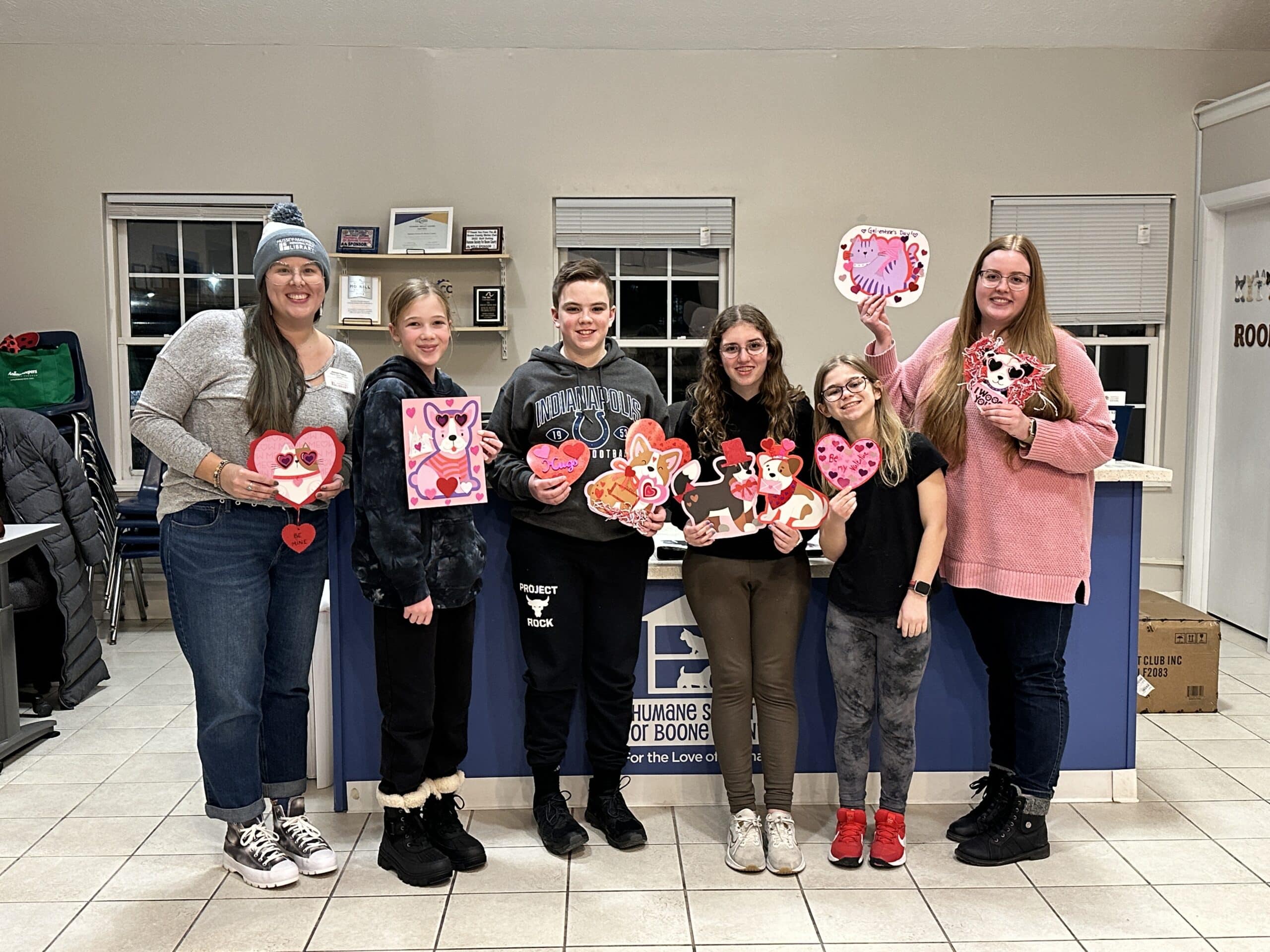 Teens showing their work at Boone County Humane Society