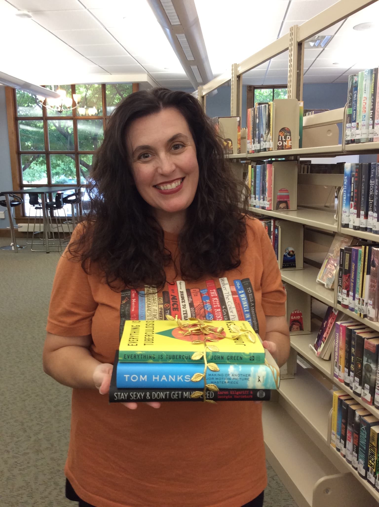 Adult holding book bundle prize